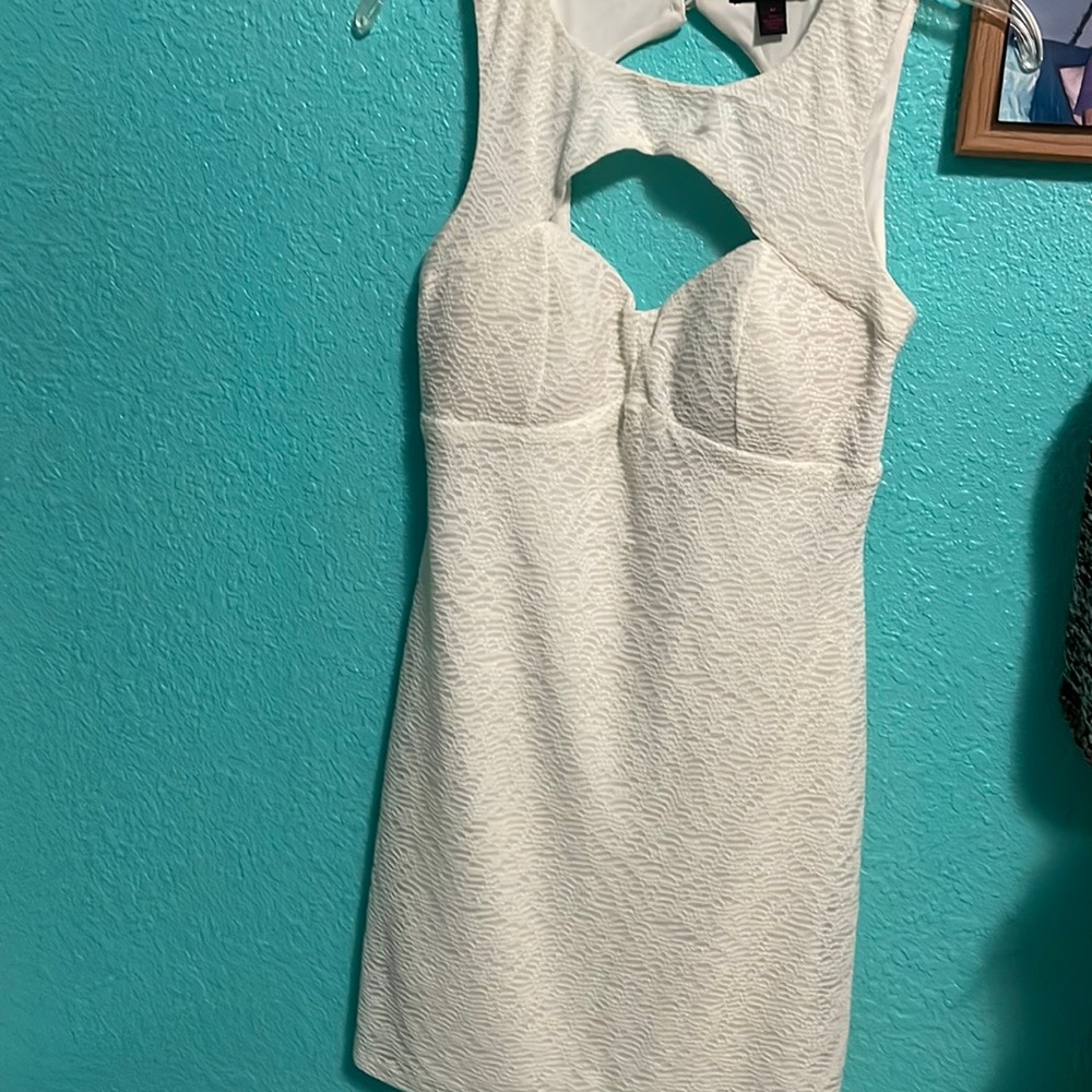Never worn. Perfect mini beige dress. Great for your next party.
